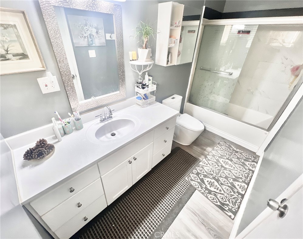 1166 El Mirage Road Adelanto, CA 92301 - Photo 10 of 21 a bathroom with a granite countertop sink and a mirror
