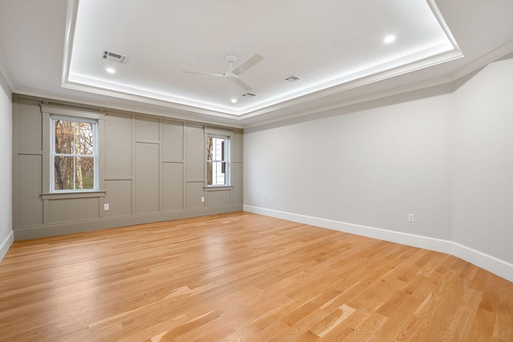 3 Whisper Way Hopkinton, MA 01748 - Photo 17 of 24 a view of empty room with wooden floor and fan