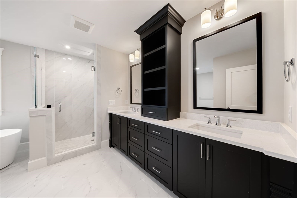 3 Whisper Way Hopkinton, MA 01748 - Photo 20 of 24 a bathroom with a double vanity sink and a mirror