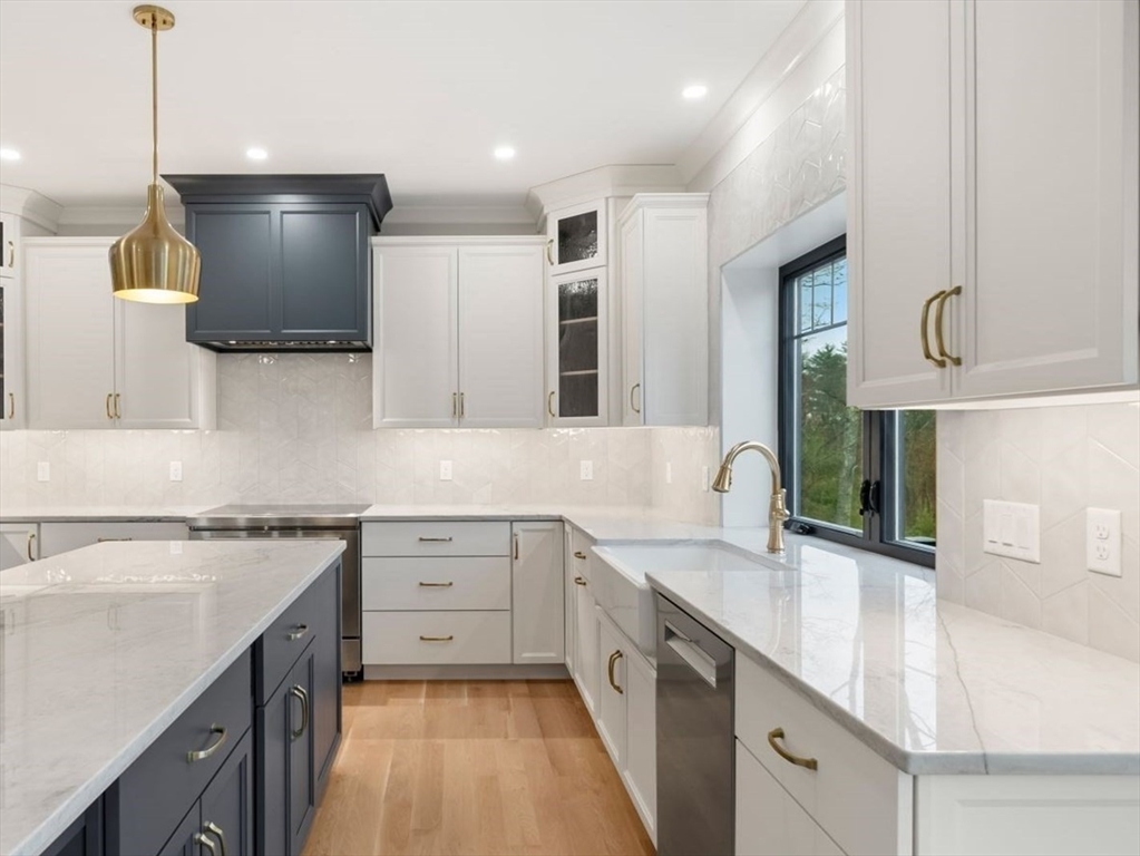 3 Whisper Way Hopkinton, MA 01748 - Photo 6 of 24 a kitchen with a sink stainless steel appliances and cabinets