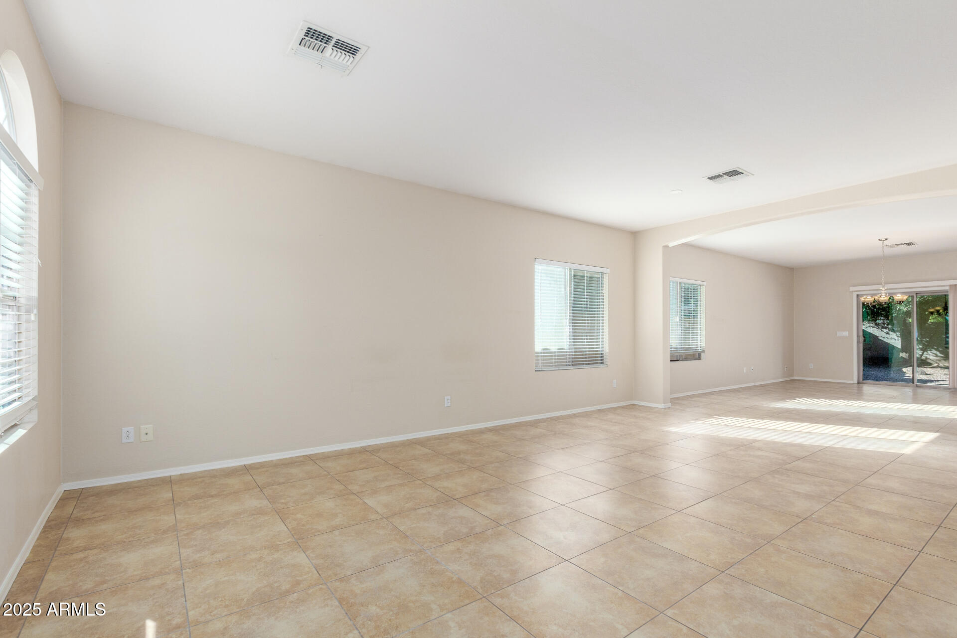 4480 South Marble Street Gilbert, AZ 85297 - Photo 3 of 26 an empty room with windows and closet