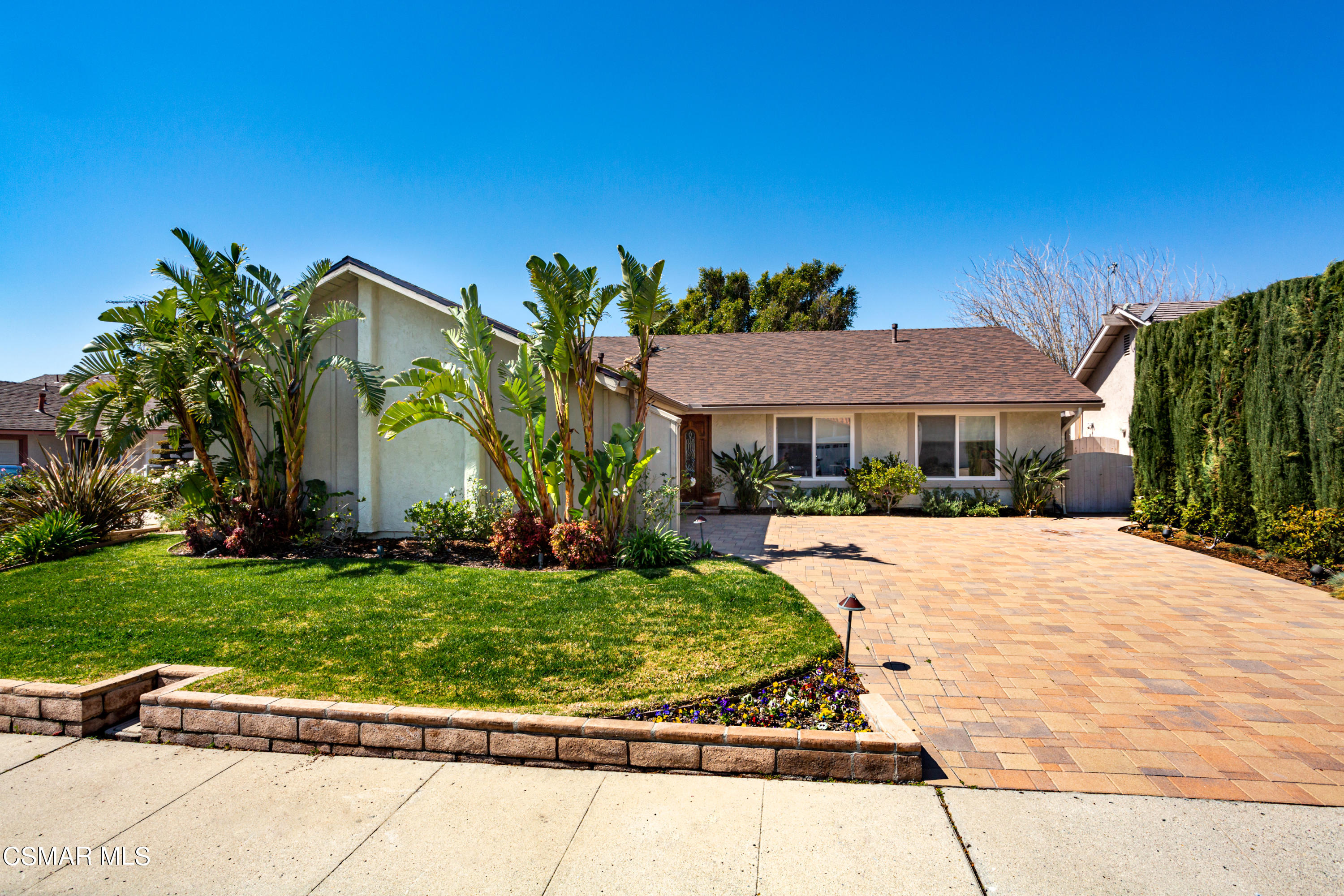 2641 Greenleaf Court Simi Valley, CA 93063 - Photo 2 of 25 a front view of a house with a garden
