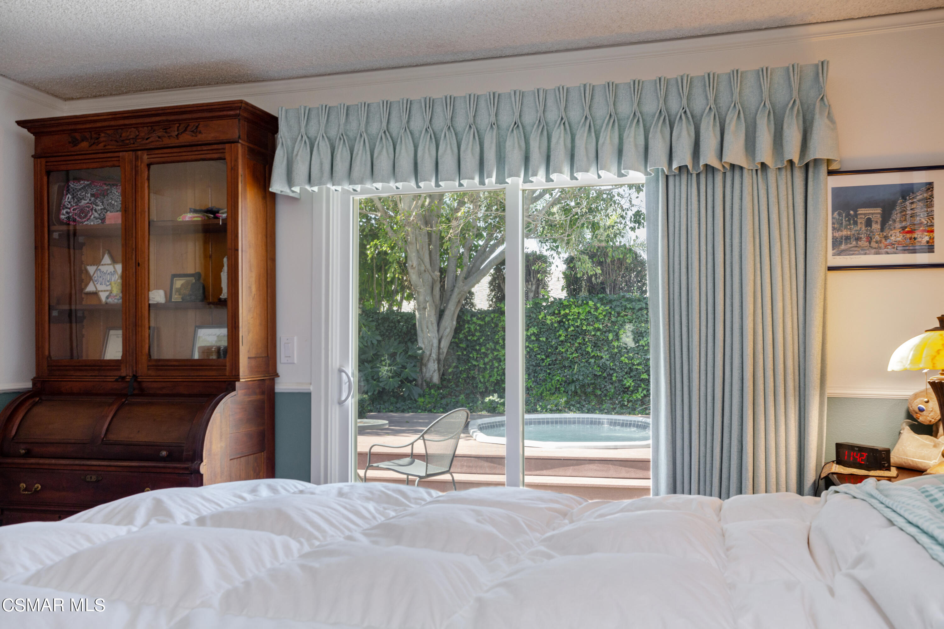 2641 Greenleaf Court Simi Valley, CA 93063 - Photo 13 of 25 a bedroom with a bed and a large window