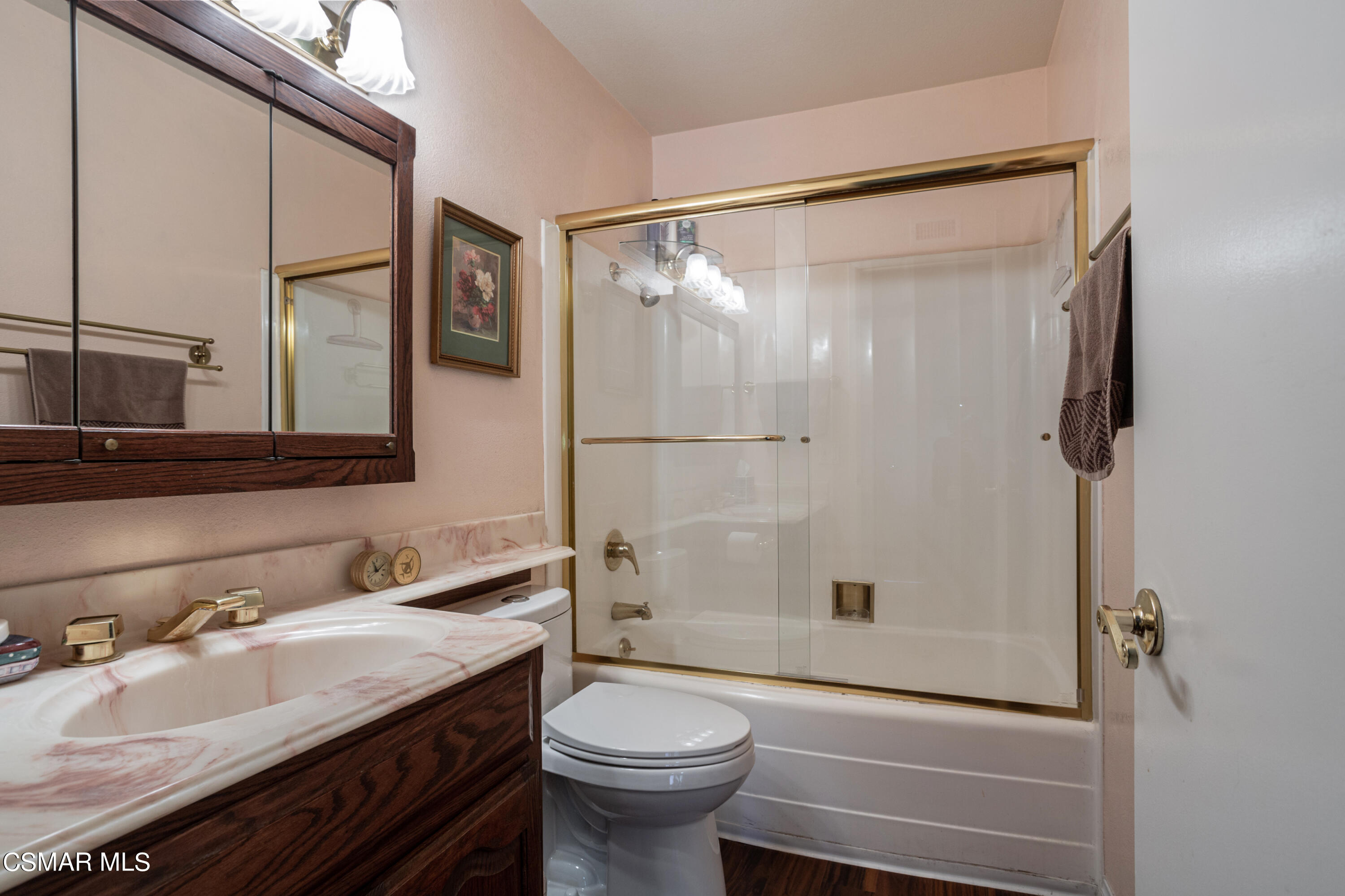 2641 Greenleaf Court Simi Valley, CA 93063 - Photo 17 of 25 a bathroom with a granite countertop sink toilet and shower