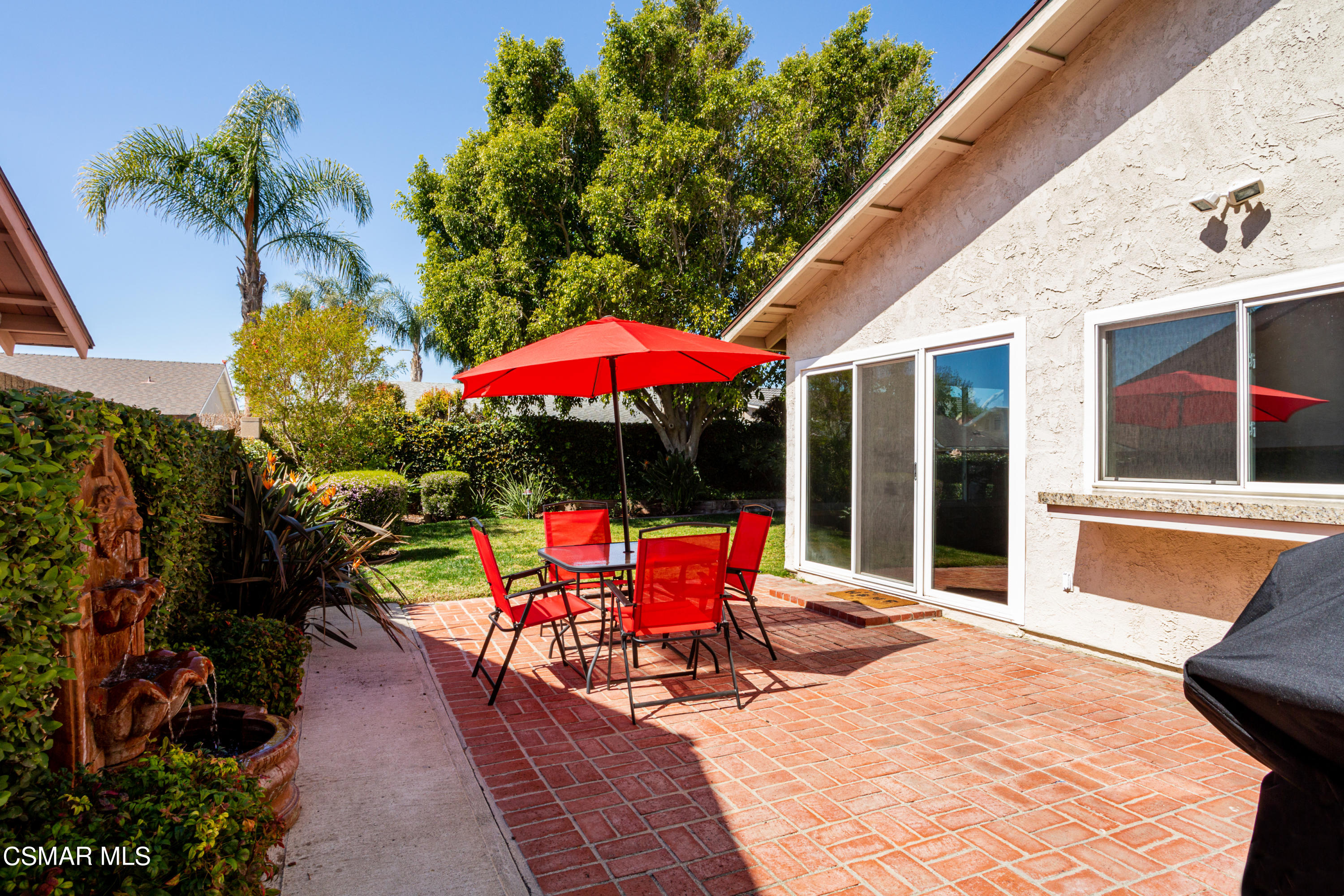 2641 Greenleaf Court Simi Valley, CA 93063 - Photo 20 of 25 an outdoor sitting area with furniture and umbrella