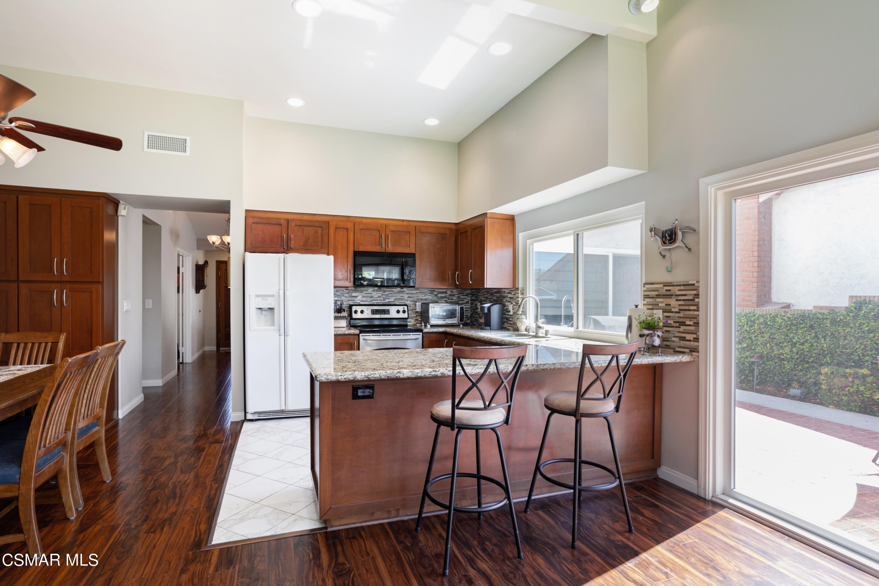 2641 Greenleaf Court Simi Valley, CA 93063 - Photo 8 of 25 a dining room with stainless steel appliances a dining table and chairs