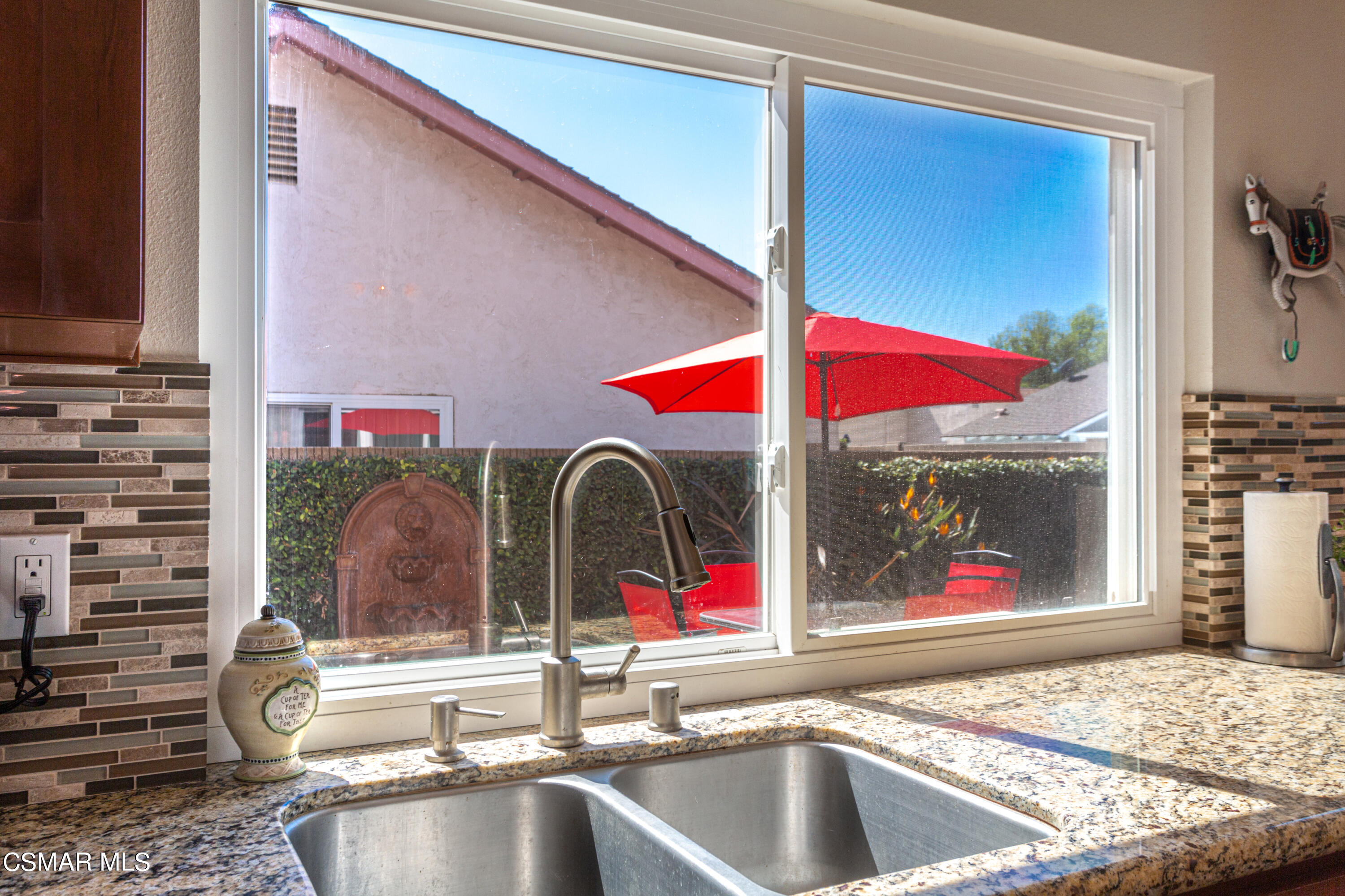2641 Greenleaf Court Simi Valley, CA 93063 - Photo 10 of 25 a kitchen view with granite countertop a sink and dishwasher a oven with a dining table