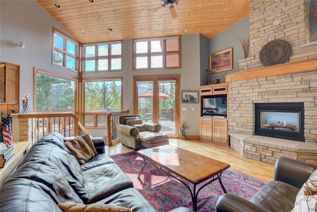 52 Rounds Road Breckenridge, CO 80424 - Photo 2 of 35 a living room with furniture large windows and a fireplace