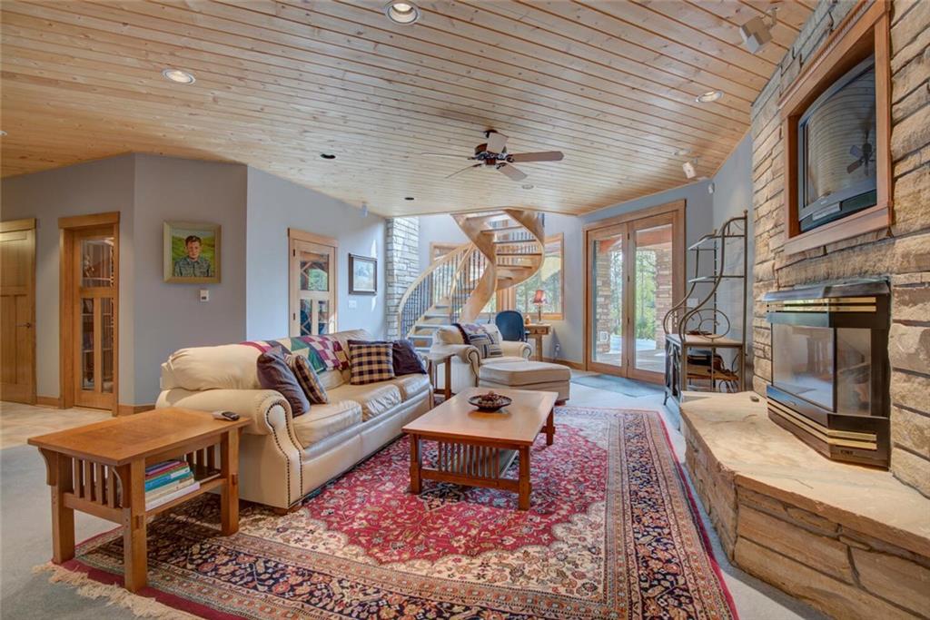 52 Rounds Road Breckenridge, CO 80424 - Photo 12 of 35 a living room with furniture a flat screen tv and a fireplace