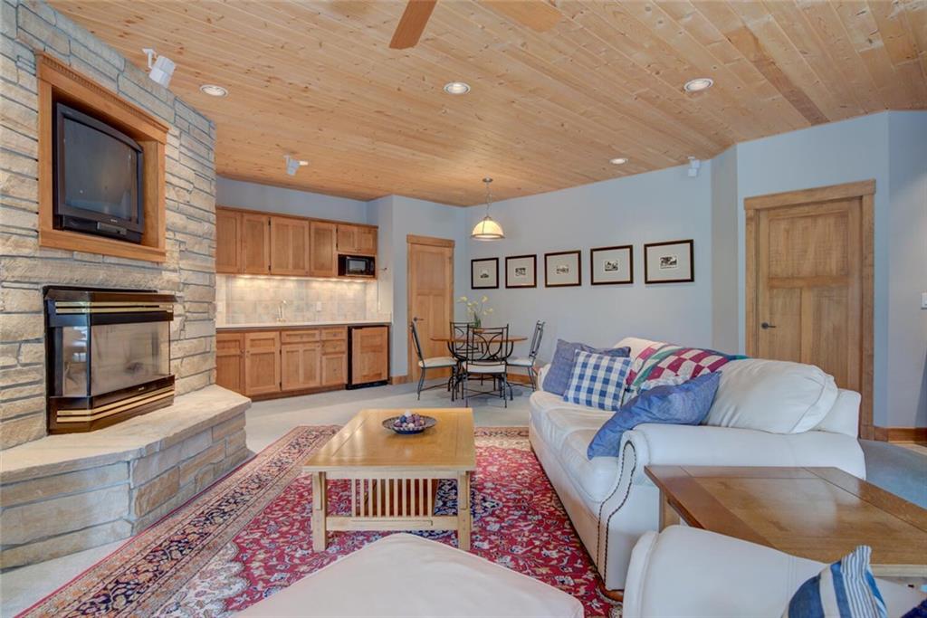 52 Rounds Road Breckenridge, CO 80424 - Photo 13 of 35 a living room with furniture fireplace and flat screen tv