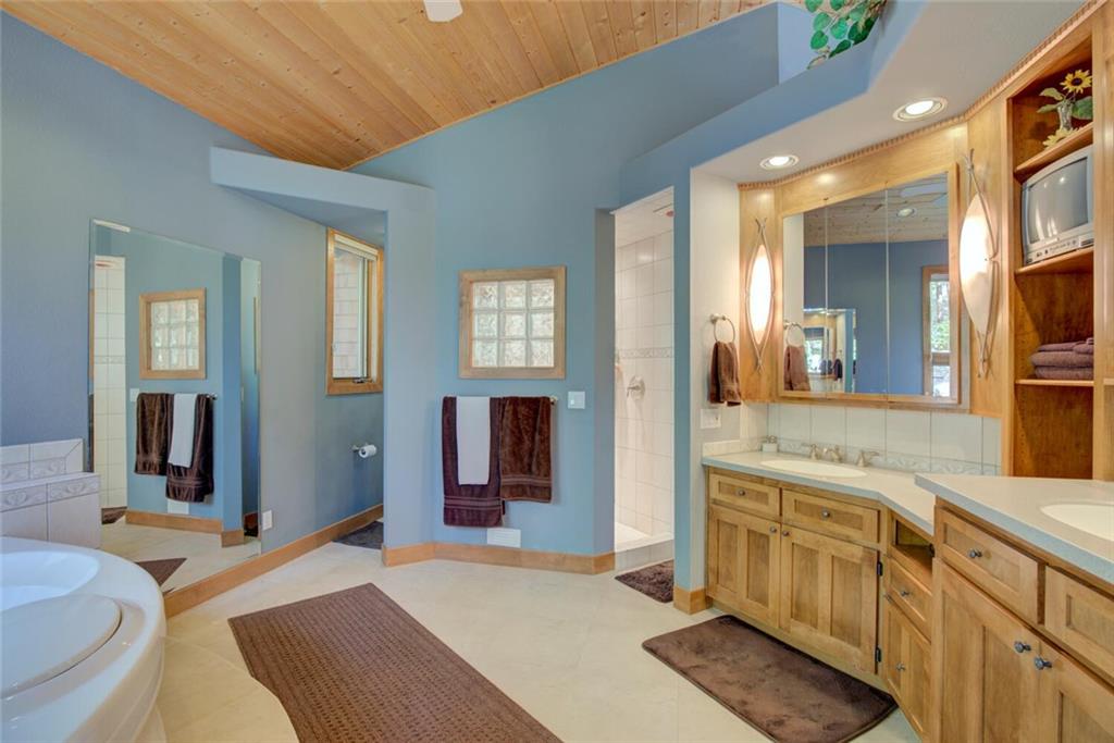 52 Rounds Road Breckenridge, CO 80424 - Photo 19 of 35 a spacious bathroom with a granite countertop sink and a mirror