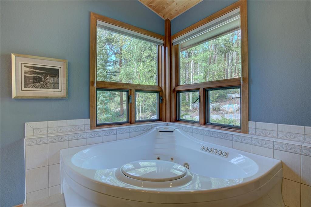52 Rounds Road Breckenridge, CO 80424 - Photo 20 of 35 a bath tub sitting in a bathroom next to a window