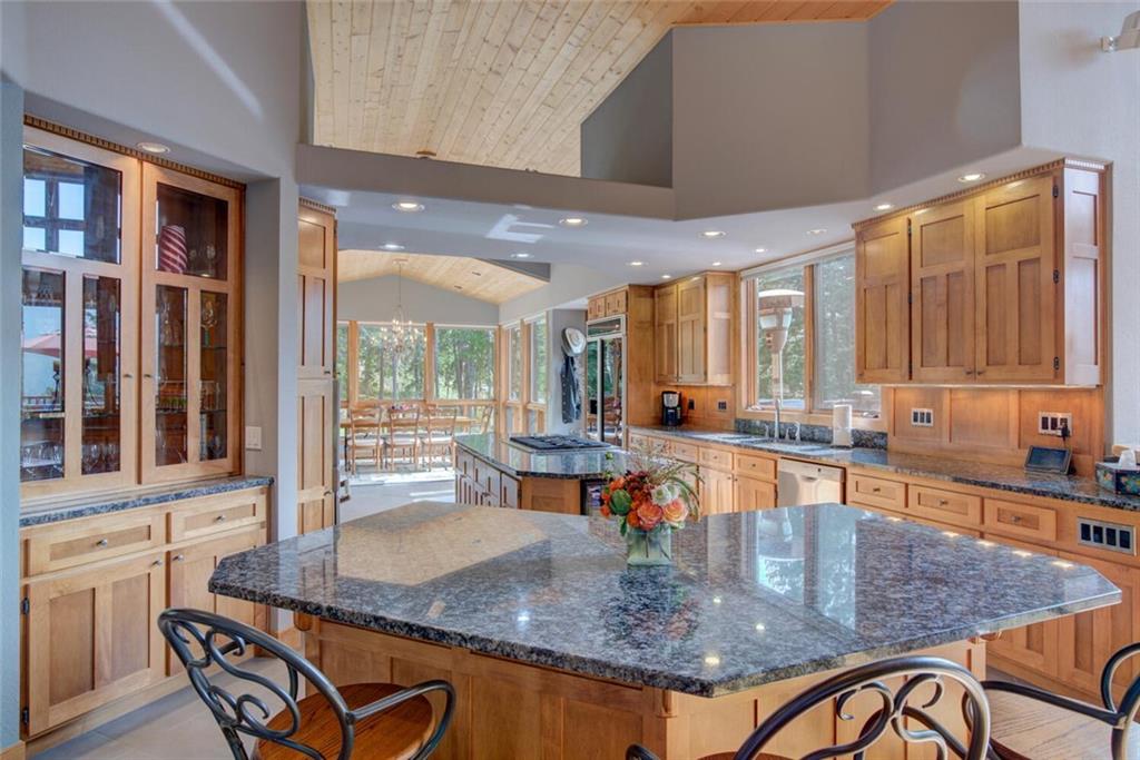 52 Rounds Road Breckenridge, CO 80424 - Photo 3 of 35 a kitchen with stainless steel appliances granite countertop a stove top oven a sink with granite countertops and cabinets