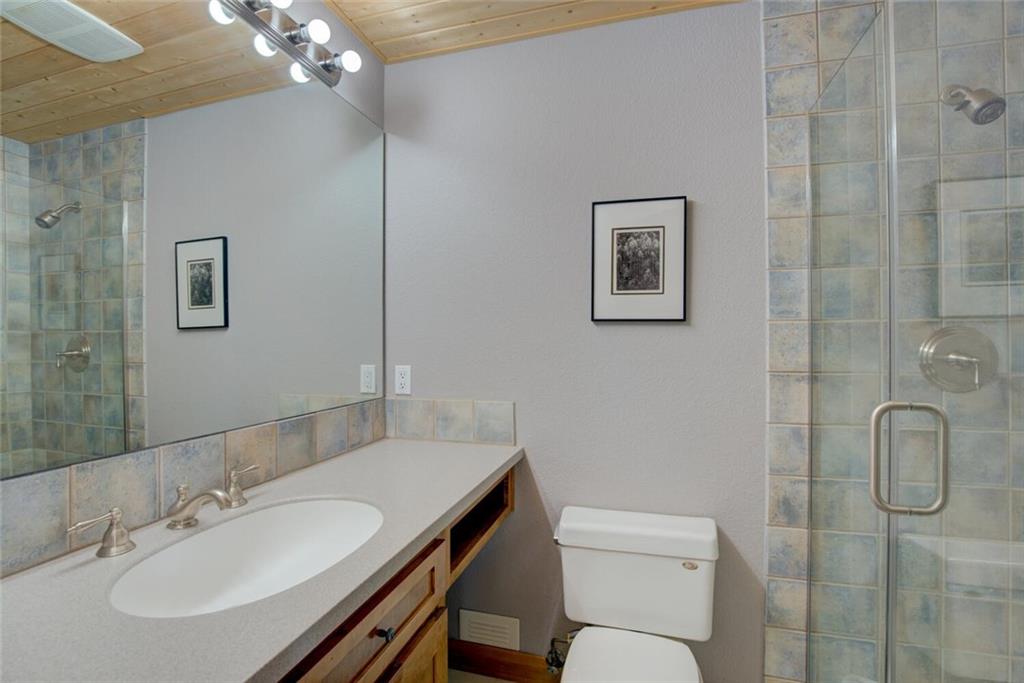 52 Rounds Road Breckenridge, CO 80424 - Photo 22 of 35 a bathroom with a toilet sink and mirror