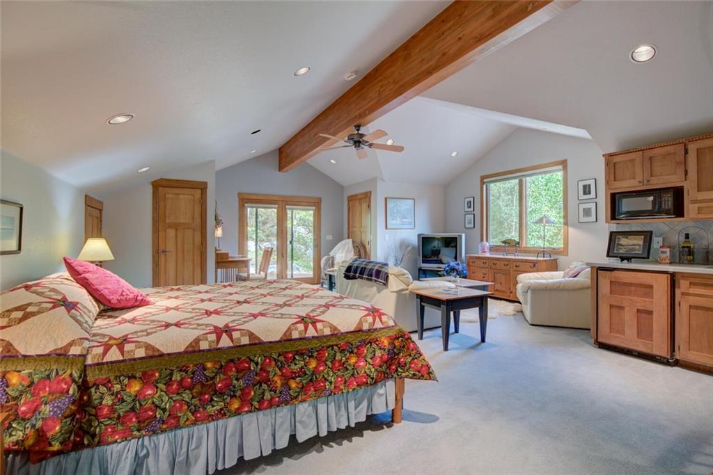 52 Rounds Road Breckenridge, CO 80424 - Photo 25 of 35 a bedroom with a bed couch and window