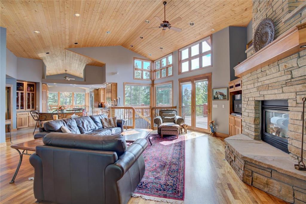 52 Rounds Road Breckenridge, CO 80424 - Photo 6 of 35 a living room with furniture large window and a fireplace