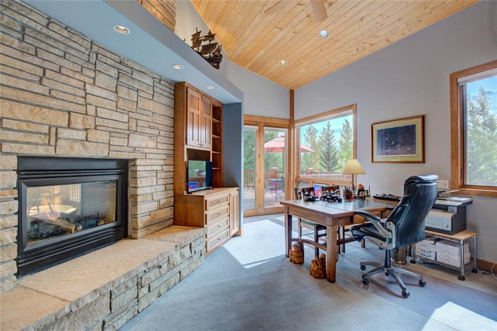 52 Rounds Road Breckenridge, CO 80424 - Photo 8 of 35 a workspace with furniture and a fireplace