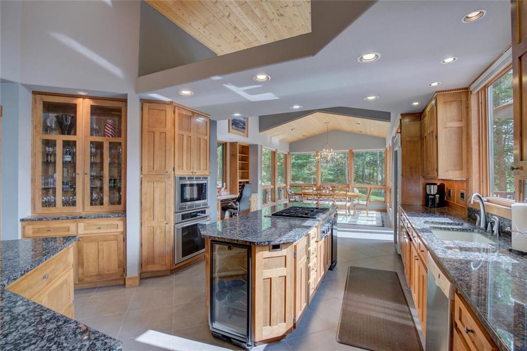 52 Rounds Road Breckenridge, CO 80424 - Photo 9 of 35 a kitchen with stainless steel appliances granite countertop sink stove and refrigerator