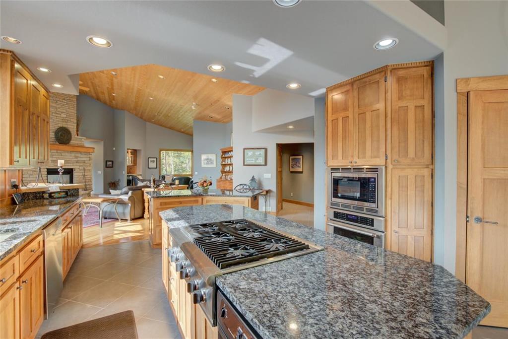 52 Rounds Road Breckenridge, CO 80424 - Photo 10 of 35 a kitchen with stainless steel appliances granite countertop a stove top oven a sink dishwasher and a refrigerator
