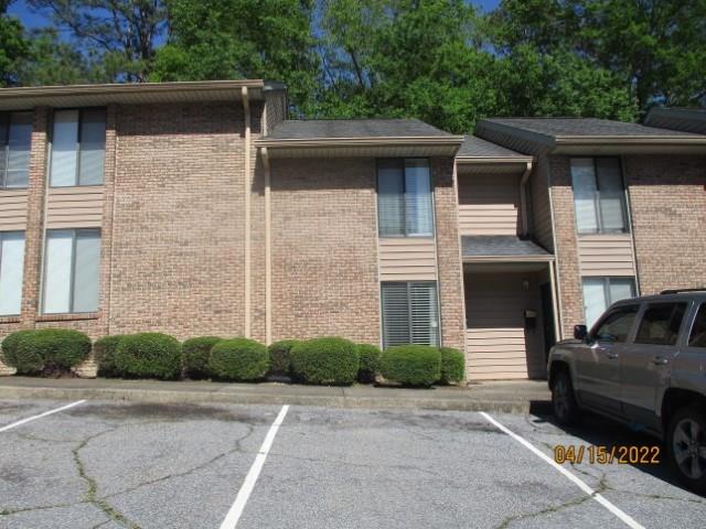 4312 Old Macon Road, Unit 29 Columbus, GA 31907 - Photo 29 of 34 a front view of a house with a garden