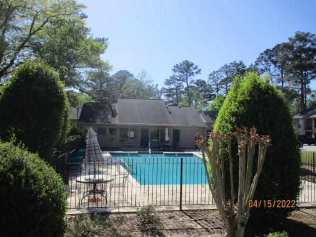 4312 Old Macon Road, Unit 29 Columbus, GA 31907 - Photo 34 of 34 a view of house with a yard and potted plants
