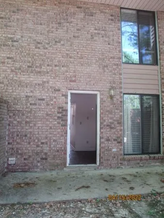 a brick building with a outdoor space