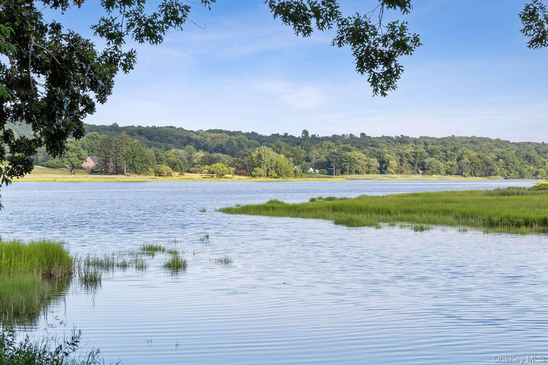 31 Factory Pond Road Locust Valley, NY 11560 - Photo 5 of 14 a view of a lake with outdoor space