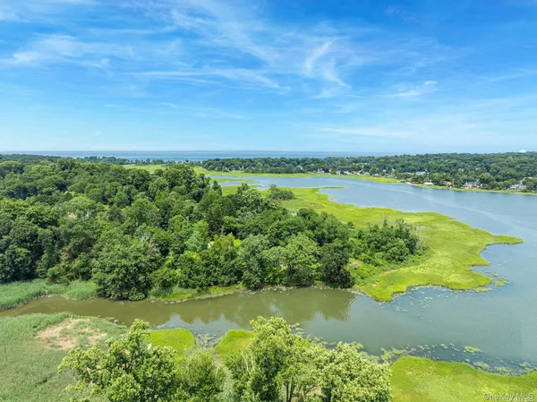 a view of a lake with a yard