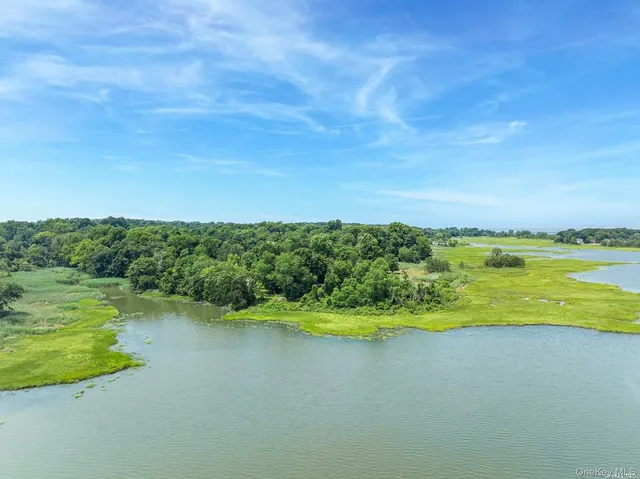a view of a lake with a big yard