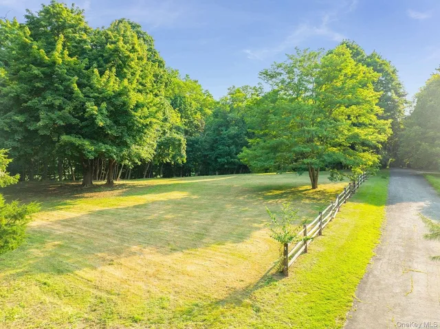 a view of a swimming pool with an outdoor space and seating area