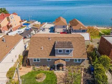an aerial view of a house with a yard