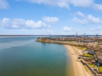 a view of a lake and trees in the background