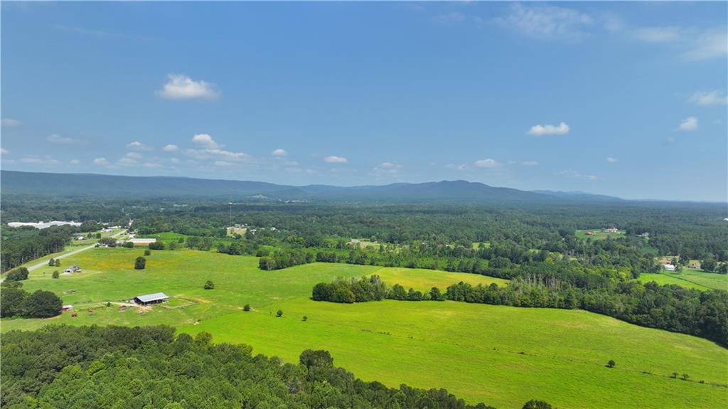 0 Sugar Valley Road Calhoun, GA 30701 - Photo 13 of 20 a view of a golf course with an outdoor space and seating