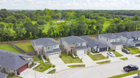 an aerial view of residential house with outdoor space and swimming pool