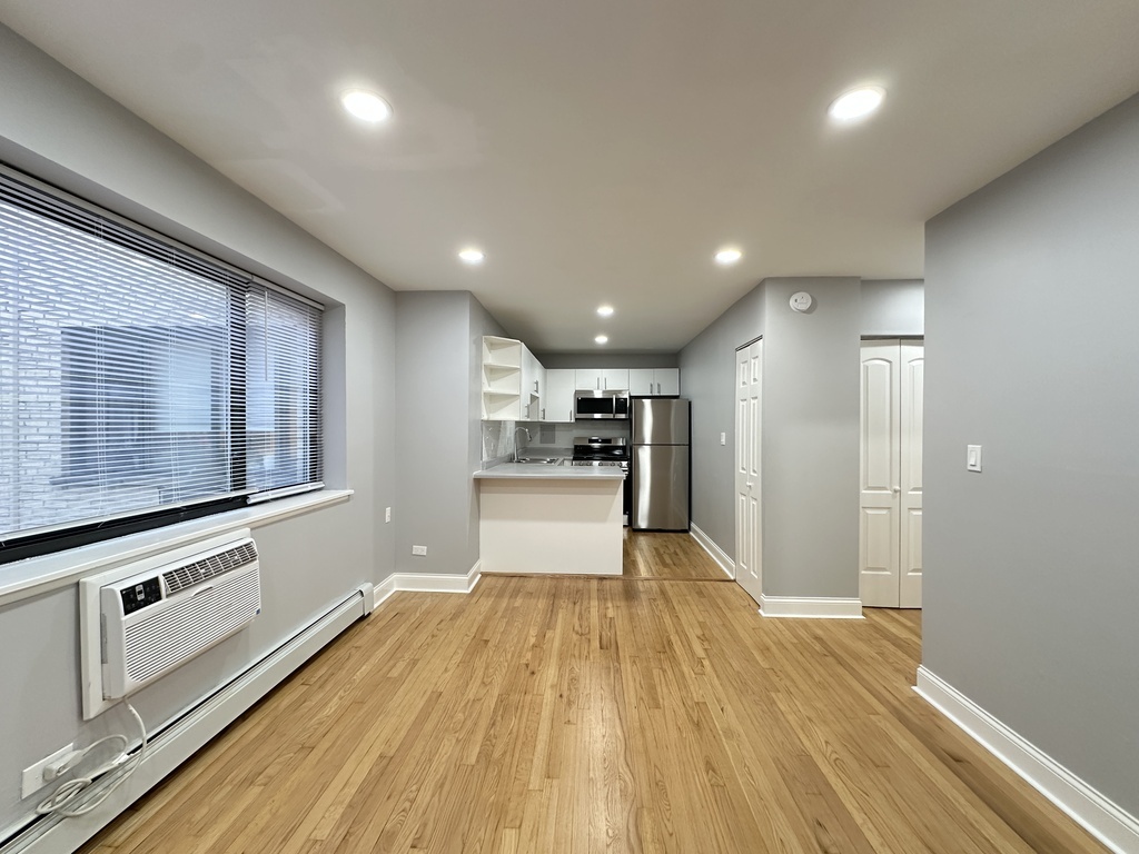 6954 North Sheridan Road, Unit 312 Chicago, IL 60626 - Photo 12 of 21 a view of a kitchen with wooden floor
