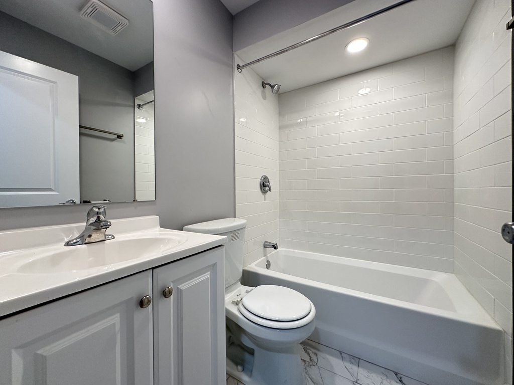 6954 North Sheridan Road, Unit 312 Chicago, IL 60626 - Photo 19 of 21 a bathroom with a sink a toilet and shower