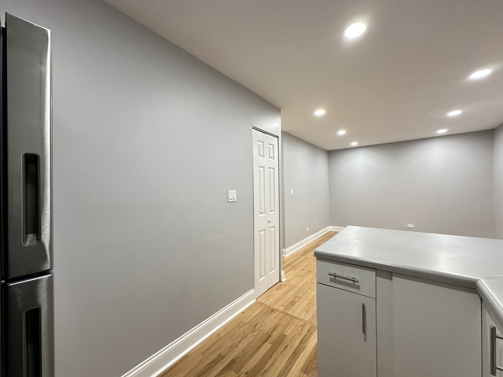 6954 North Sheridan Road, Unit 312 Chicago, IL 60626 - Photo 8 of 21 a view of wooden floor and staircase