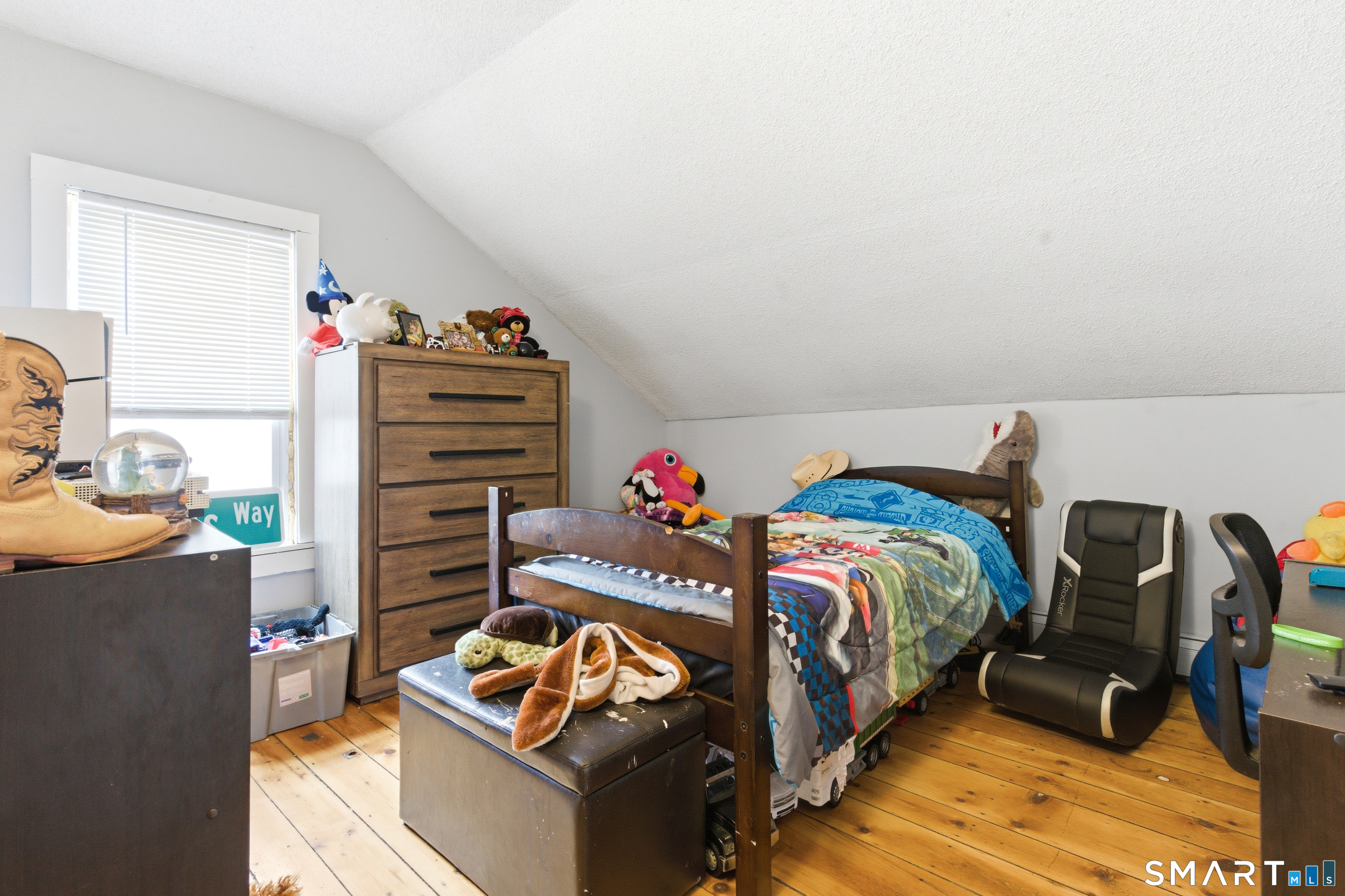 36 Church Street Killingly, CT 06241 - Photo 32 of 39 a bedroom with a bed and a couch