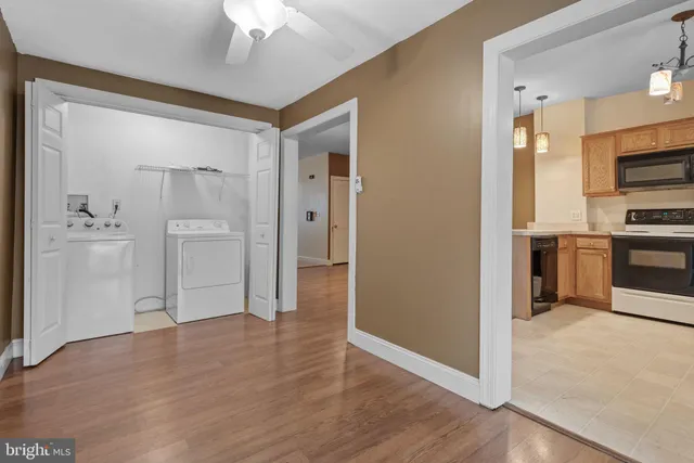 a view of a kitchen with a sink and cabinet area