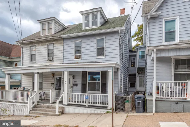 front view of a house with a street