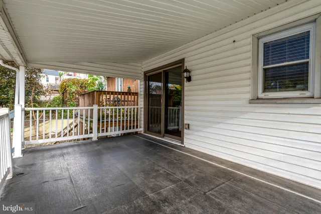 a view of a porch with wooden stairs