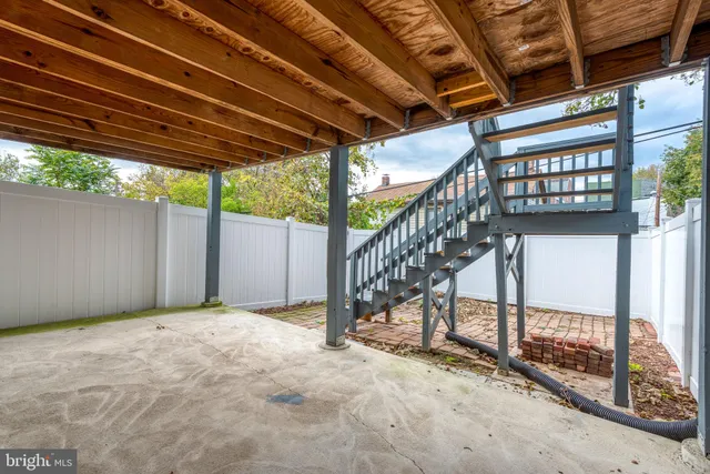 a view of empty room with wooden ceiling