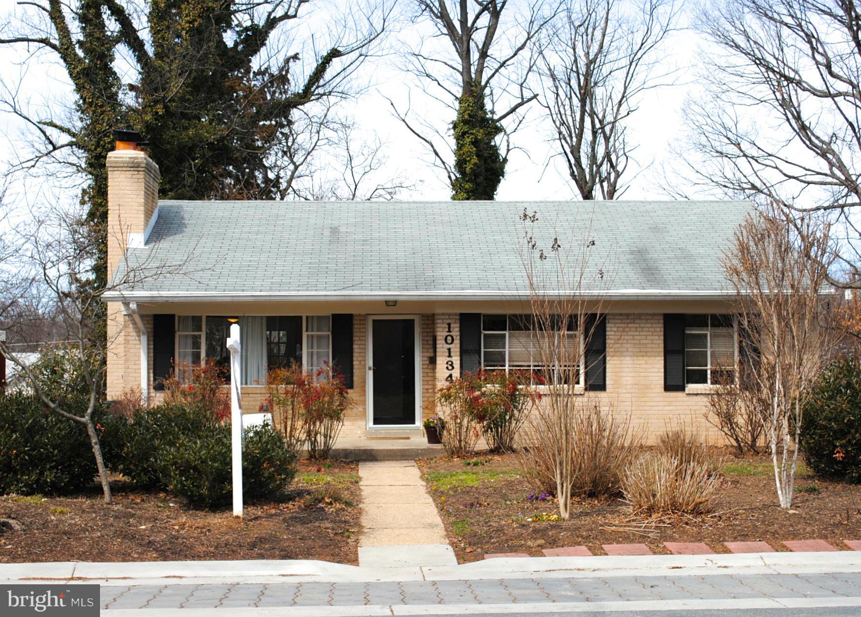 10134 Dallas Avenue Silver Spring, MD 20901 - Photo 1 of 27 a front view of a house with garden