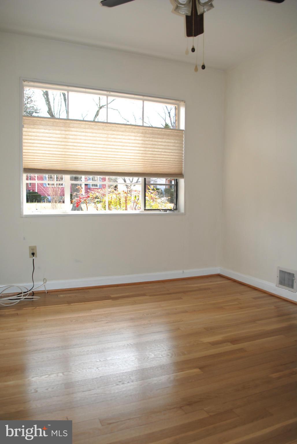 10134 Dallas Avenue Silver Spring, MD 20901 - Photo 15 of 27 a view of wooden floor and windows in a room