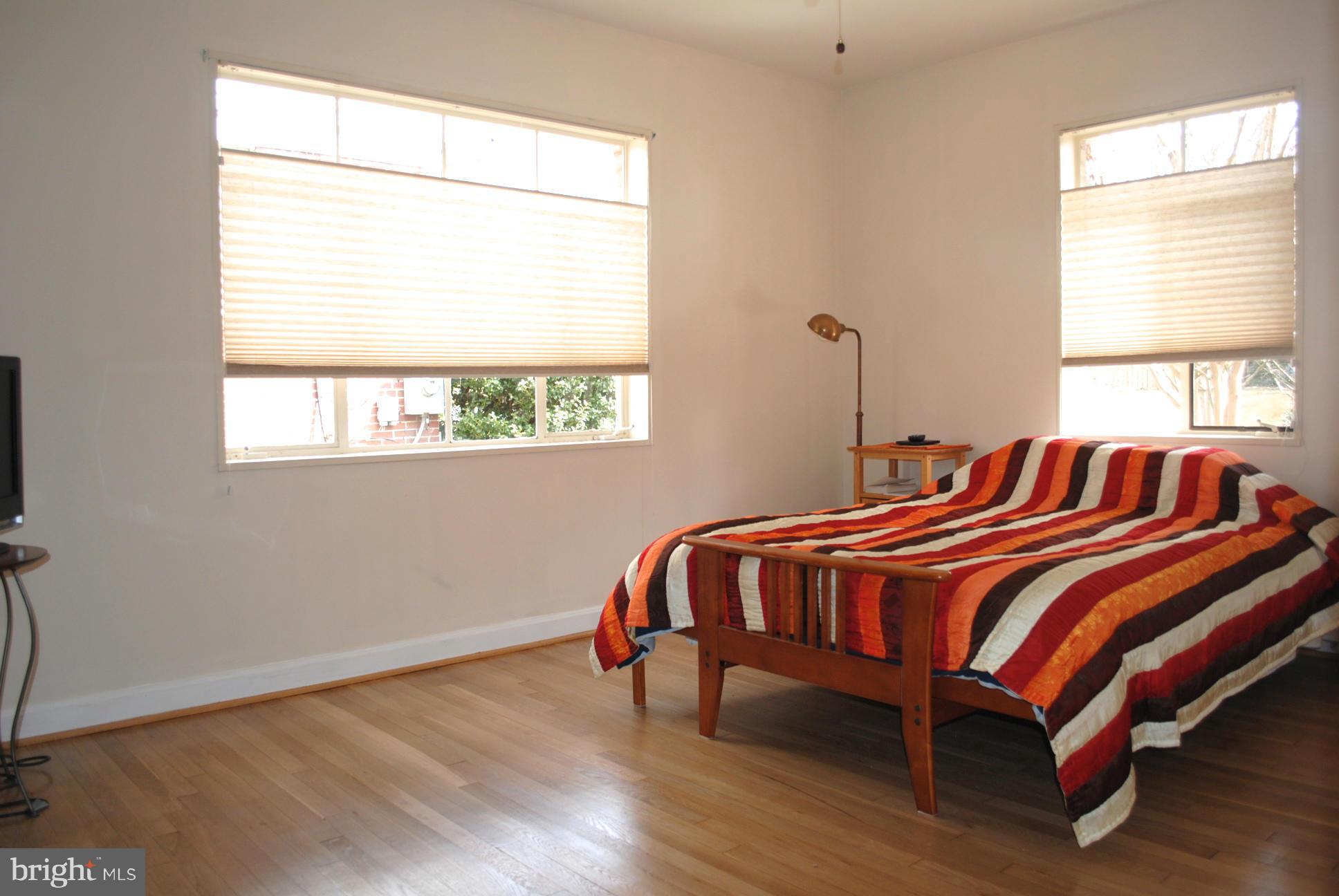 10134 Dallas Avenue Silver Spring, MD 20901 - Photo 17 of 27 a bed sitting in a bedroom next to a window
