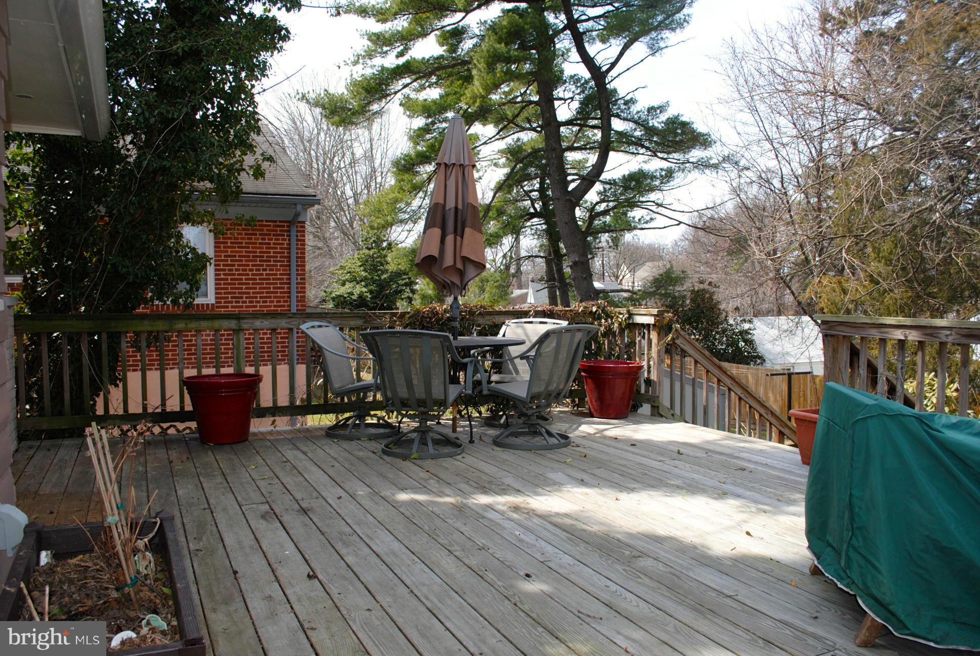 10134 Dallas Avenue Silver Spring, MD 20901 - Photo 26 of 27 a patio with wooden floor and outdoor seating
