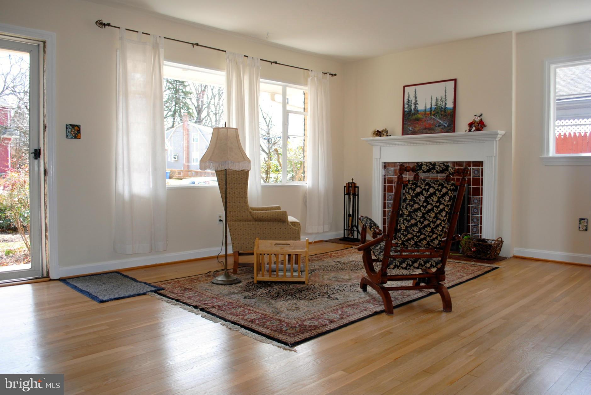 10134 Dallas Avenue Silver Spring, MD 20901 - Photo 5 of 27 a living room with furniture and a fireplace