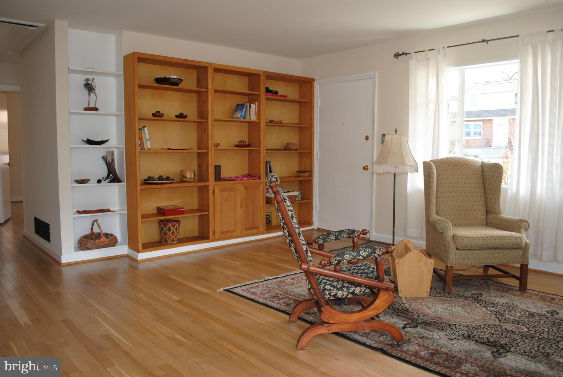 10134 Dallas Avenue Silver Spring, MD 20901 - Photo 6 of 27 a living room with furniture cabinets and wooden floor