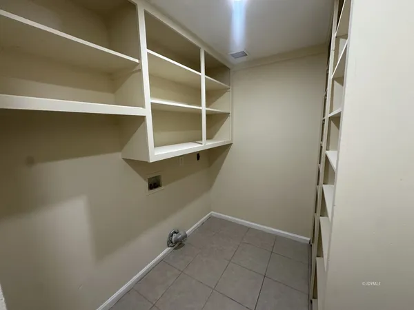 a view of an empty walk in closet