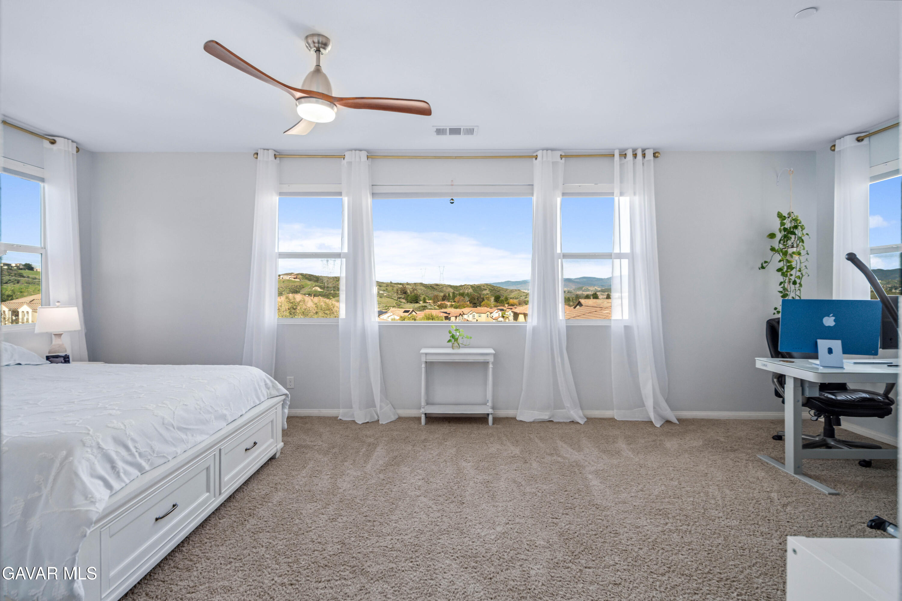 19849 Via Ott Santa Clarita, CA 91321 - Photo 1 of 52 a spacious bedroom with a bed and a window
